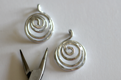 Margot Potter's Calder-inspired Earrings - , Contemporary Wire Jewelry, Dapping, Dapping Jewelry, Forging, Forging Jewelry, Jewelry Forging, Spirals, Wire Spiral, Spiral Wire Wrap, pull out the spiral into a pyramid